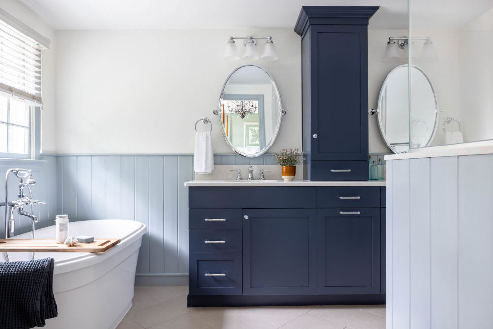 Bathroom Design-Build Remodel with blue cabinetry and soaking tub